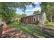 Spacious backyard with a patio and a wooden fence offering a serene outdoor space at 83 Reef Run Rd., Pawleys Island, SC 29585