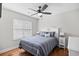 Charming bedroom featuring a decorative headboard, ceiling fan, and natural light from the window at 83 Reef Run Rd., Pawleys Island, SC 29585