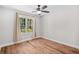 Bright empty room with hardwood floors and a window providing plenty of natural light at 83 Reef Run Rd., Pawleys Island, SC 29585