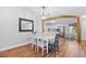 Bright dining area showcasing a modern light fixture, view into the kitchen, and a charming breakfast nook at 83 Reef Run Rd., Pawleys Island, SC 29585