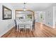 Bright dining area with wood flooring and plenty of natural light adjacent to a modern, stainless steel kitchen at 83 Reef Run Rd., Pawleys Island, SC 29585