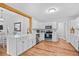 Spacious eat-in kitchen featuring stainless steel appliances and white cabinets at 83 Reef Run Rd., Pawleys Island, SC 29585