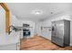 Spacious eat-in kitchen featuring stainless steel appliances and white cabinets at 83 Reef Run Rd., Pawleys Island, SC 29585