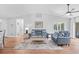 Bright living room with vaulted ceilings, comfortable seating, stylish decor, and access to outdoor patio at 83 Reef Run Rd., Pawleys Island, SC 29585