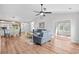 Open living space featuring vaulted ceiling, dining area, and comfortable seating arrangement bathed in natural light at 83 Reef Run Rd., Pawleys Island, SC 29585