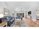 Bright and airy living room featuring vaulted ceilings, neutral decor, and a seamless connection to the outdoors at 83 Reef Run Rd., Pawleys Island, SC 29585
