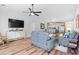 Open concept living area with a ceiling fan, bright natural light, and view of dining and kitchen spaces at 83 Reef Run Rd., Pawleys Island, SC 29585