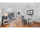 Open-concept living room with hardwood floors, vaulted ceilings, and neutral decor, creating a bright and airy space at 83 Reef Run Rd., Pawleys Island, SC 29585
