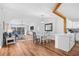 Open concept living space including kitchen, dining area, and a comfortable living room with a sliding glass door at 83 Reef Run Rd., Pawleys Island, SC 29585