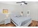 Main bedroom with neutral walls and trim featuring a large window and fan at 83 Reef Run Rd., Pawleys Island, SC 29585