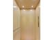Interior view of a modern elevator featuring wood paneled walls, recessed lighting, and user friendly controls at 8461 Waltzing Waves Ct. # 24, Myrtle Beach, SC 29572