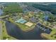 Aerial view of community amenities: pool, tennis courts, sand volleyball court, and dock at 904 Kalmia Ct., Myrtle Beach, SC 29579