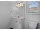 Bathroom featuring vanity, toilet, and window at 904 Kalmia Ct., Myrtle Beach, SC 29579