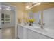 Bathroom features a double sink with a large mirror and floral arrangement on the counter at 904 Kalmia Ct., Myrtle Beach, SC 29579