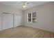 Bedroom with ceiling fan, hardwood floors, window, and closet space at 904 Kalmia Ct., Myrtle Beach, SC 29579