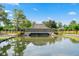 Plantation Lakes entrance sign, a picturesque pond, and lush landscaping at 904 Kalmia Ct., Myrtle Beach, SC 29579