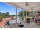 Covered patio featuring outdoor seating and a view of the pool and lake at 904 Kalmia Ct., Myrtle Beach, SC 29579