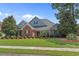 Charming home boasts well-manicured lawn, mature trees, and tasteful landscaping at 904 Kalmia Ct., Myrtle Beach, SC 29579