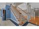 View of staircase with hardwood steps, white risers, and open floor plan at 904 Kalmia Ct., Myrtle Beach, SC 29579