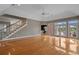 Bright living area featuring hardwood floors, ceiling fan, and staircase at 904 Kalmia Ct., Myrtle Beach, SC 29579