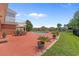 An expansive patio area with a dining set, lounge chairs, and a view of the pool and waterfront at 904 Kalmia Ct., Myrtle Beach, SC 29579