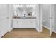 Bright bathroom with double sinks, granite countertops, and modern fixtures at 932 Abernathy Place, Surfside Beach, SC 29575