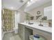 Well-lit bathroom featuring a shower/tub combination and extended vanity at 932 Abernathy Place, Surfside Beach, SC 29575