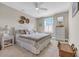 Inviting bedroom with wicker furnishings, a comfortable bed, and soft, neutral decor for a relaxing retreat at 932 Abernathy Place, Surfside Beach, SC 29575