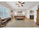Spacious bedroom with a wooden bed frame and large windows with shutter blinds at 932 Abernathy Place, Surfside Beach, SC 29575