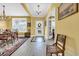 Spacious foyer featuring tile flooring, chandelier lighting, and a welcoming entryway leading to the living areas at 932 Abernathy Place, Surfside Beach, SC 29575