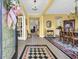 Bright foyer with decorative tile accents, an open floor plan, and views of the dining area and living spaces at 932 Abernathy Place, Surfside Beach, SC 29575