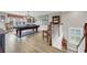 Large game room with a billiard table and lots of natural light at 932 Abernathy Place, Surfside Beach, SC 29575