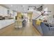 Open-concept kitchen and living area with a large island and modern appliances at 932 Abernathy Place, Surfside Beach, SC 29575