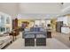 Inviting living room with sofa, ottomans, and adjacent kitchen/dining area at 932 Abernathy Place, Surfside Beach, SC 29575