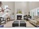 Elegant living room showcasing a fireplace, piano, and comfortable seating at 932 Abernathy Place, Surfside Beach, SC 29575