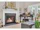 Living room showing a fireplace with decor and sitting area with piano at 932 Abernathy Place, Surfside Beach, SC 29575