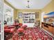Cozy living room with a built-in bookshelf, comfortable seating, and a view of the backyard at 932 Abernathy Place, Surfside Beach, SC 29575