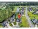 Aerial view of a home near a pond and golf course surrounded by lush greenery at 1009 Maccoa Dr., Conway, SC 29526
