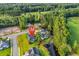 Aerial view of home near a pond and golf course with lush surrounding trees and nearby waterway at 1009 Maccoa Dr., Conway, SC 29526