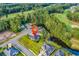 Aerial view of home near a pond and golf course with lush surrounding trees and beautiful neighborhood at 1009 Maccoa Dr., Conway, SC 29526