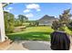 Backyard with a view of a pond and golf course with a patio and lush lawn at 1009 Maccoa Dr., Conway, SC 29526