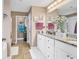 Bathroom with double sink, granite countertops, and tile floors, providing elegance and functionality at 1009 Maccoa Dr., Conway, SC 29526