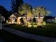 Charming single-story home at night with manicured landscaping and warm exterior lighting at 1009 Maccoa Dr., Conway, SC 29526