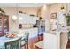 Charming kitchen with white cabinets, stainless steel appliances, and a cozy dining area at 1009 Maccoa Dr., Conway, SC 29526