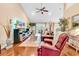 Cozy living room with high ceilings, lots of light, ceiling fan, and comfortable furniture at 1009 Maccoa Dr., Conway, SC 29526