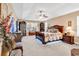 Spacious main bedroom featuring a ceiling fan and dark wood furniture with unique decorations at 1009 Maccoa Dr., Conway, SC 29526