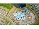 Overhead view of the community pool, dock, playground, parking area, and surrounding homes and neighborhood streets at 1016 Laurens Mill Dr., Myrtle Beach, SC 29579