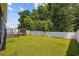 Backyard featuring privacy fence, green lawn, and wooden deck at 1016 Laurens Mill Dr., Myrtle Beach, SC 29579