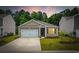 Charming single-story home featuring a one-car garage, manicured lawn, and inviting curb appeal at 1016 Laurens Mill Dr., Myrtle Beach, SC 29579