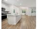 Open concept kitchen with stainless appliances, a center island, and a view to the living area at 1016 Laurens Mill Dr., Myrtle Beach, SC 29579